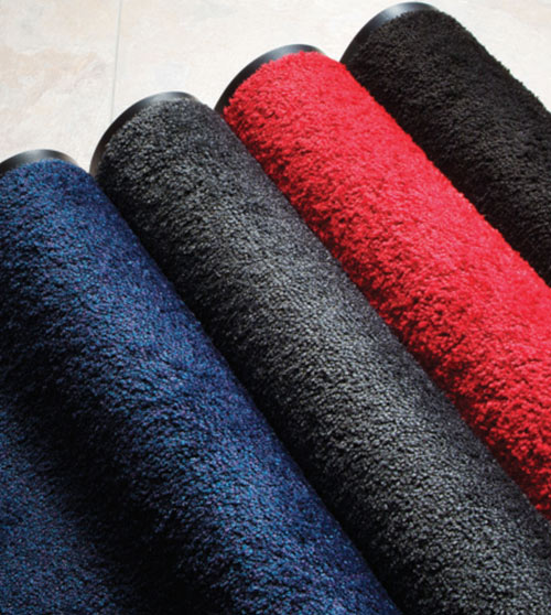 Carpet mats are seen in 4 different colors: blue, gray, red, and black.