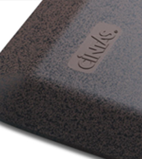 Close up view of the corner of a Cintas rubber floor mat.