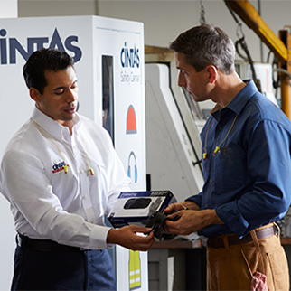 Cintas Employee Showing Client Product